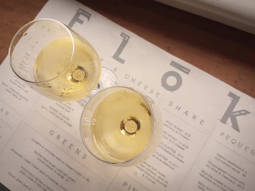 Two glasses of sherry from above on the FLoK menu (meat and cheese share list visible)